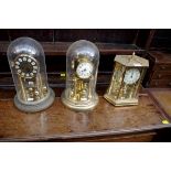 Three brass anniversary clocks.