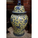 A large Chinese blue and yellow glazed vase and cover, 81cm high.