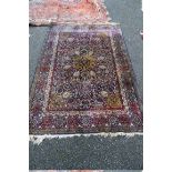 A Silk Tabriz rug, having allover floral and geometric design, 182 x 120cm.