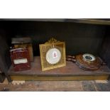 A gilt brass easel back photograph frame, 20cm high; together with an aneroid barometer; and a