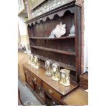 A George III oak pot board dresser and rack, 173cm wide.