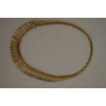 A 9ct gold fringed necklace, 20g.