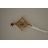 An Edwardian 9ct gold amethyst and seed pearl pendant.