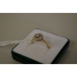 An 18ct gold diamond daisy head ring.