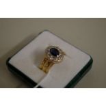 An 18ct gold sapphire and diamond ring.