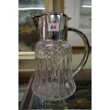 A cut glass lemonade jug with silver plated mounts, 30cm.