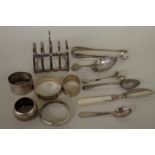 A mixed group of silver, to include: a pair of silver Georgian sugar tongs; two silver bangles;