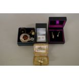 A boxed 9ct gold and cubic zirconia pendant and matching earrings; together with an 800 Scottish