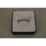 Four unmarked eternity rings; together with a 15ct gold ring, 2.3g.