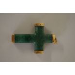 A chunky green jade cross having yellow metal mounts, 60mm x 38mm.