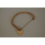 A 15ct gold link bracelet, having heart padlock, 17.5g.