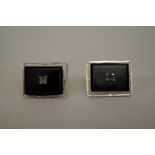 A pair of Chinese 14k white gold and black onyx cufflinks, 12.2g all in. (a/f)