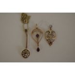 An 9ct gold Edwardian pendant set amethysts; together with a similar example set pearl and ruby; and