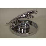 A Jaguar Cars chrome plated leaping cat ashtray, 12cm high.