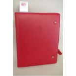 Ferrari: an FF red leather 'new owner's welcome pack', with branded drawstring dust bag, boxed;