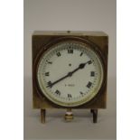 A vintage brass dashboard timepiece, of eight day duration, 11.5cm high.