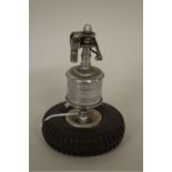 A vintage novelty Dunlop tyre table lighter, 11cm high.