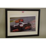 Photographs: a colour image of Jensen Button in McLaren, signed, image 19 x 30cm.