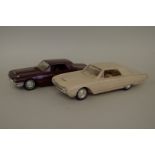 Two rare 1950s Ford Thunderbird plastic scale models.