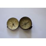 Two old pocket compasses.
