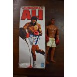 A 1970s Muhammed Ali doll, boxed.