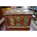A late 19th/early 20th century oak gilt metal mounted casket, possibly for cigars, 29cm wide.