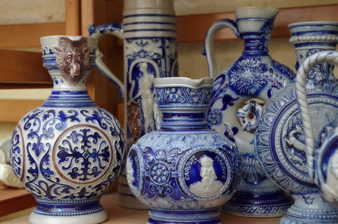 A collection of German salt glazed pottery jugs and vases, largest 37.5cm high. (2 shelves) - Image 5 of 6