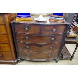 A Regency mahogany bowfront chest, with reeded outset pilasters, 107cm wide.