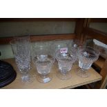 A set of six drinking glasses; together with a pair of Thomas Webb flutes.