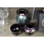 Three Isle Of Wight iridescent glass vases, largest 14cm high.