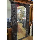 A 16th century and later carved oak framed large wall mirror, with gothic tracery decoration, 170