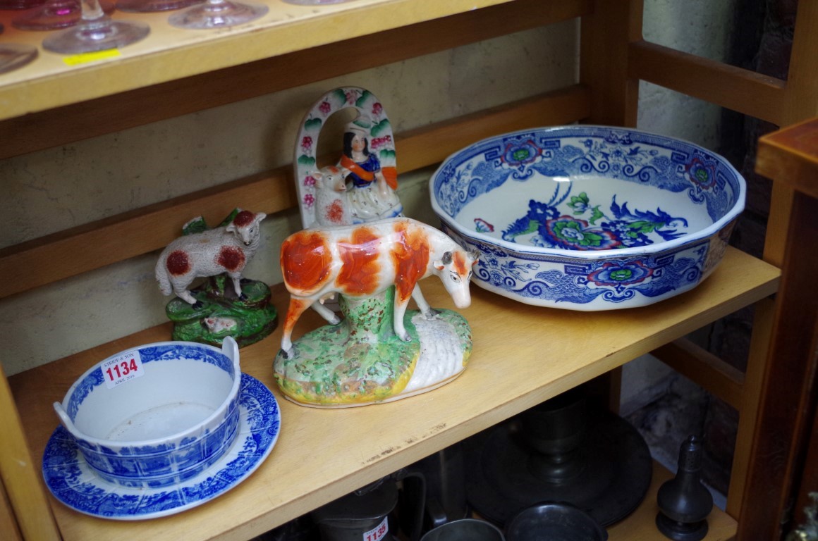 A small group of pottery, to include three Staffordshire figures.