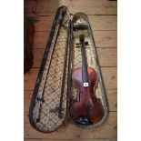 An antique Continental violin, with 14in back, (cracked), with ebonized case and two bows.