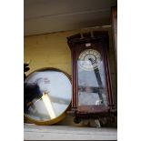 A small mahogany wall clock, with enamel dial, 45cm high, with pendulum; together with a vintage