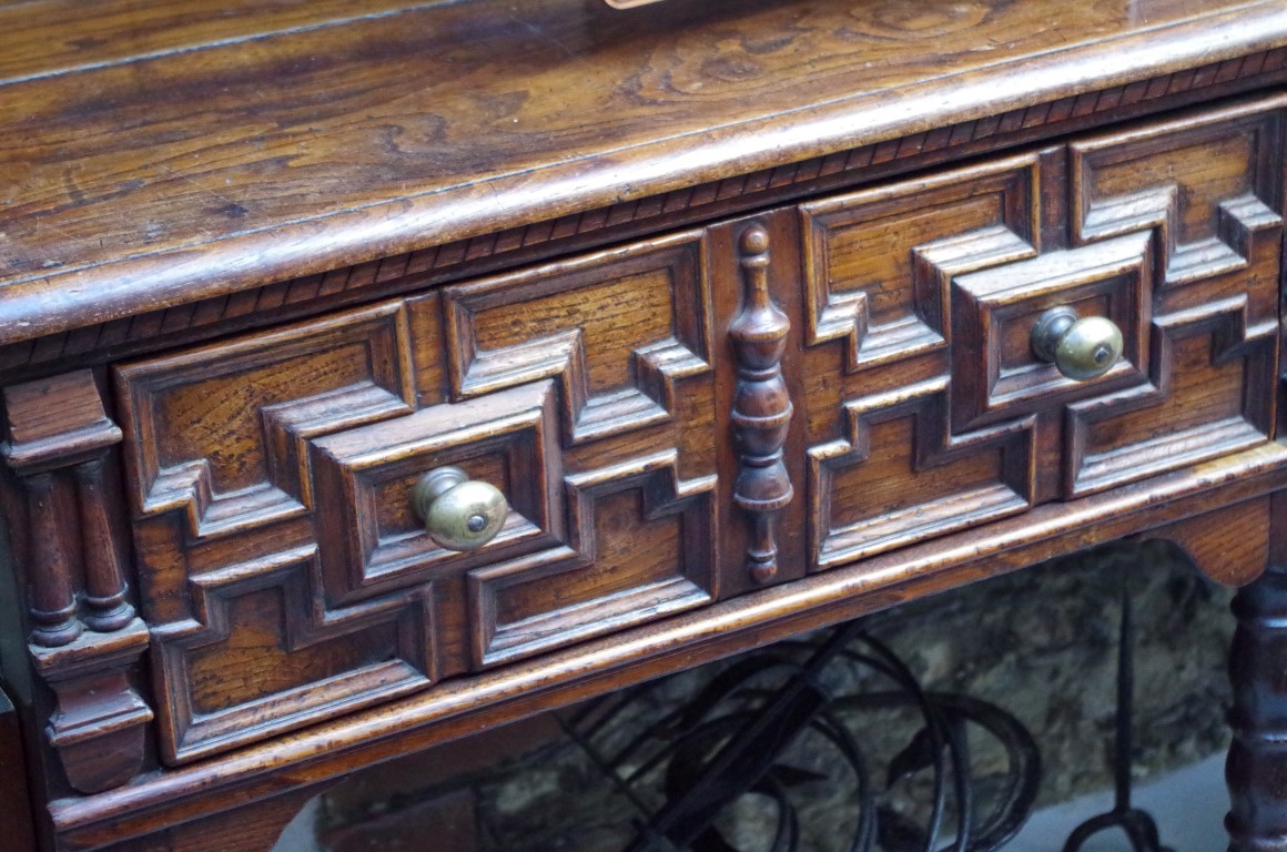 An 18th century oak dresser base, with geometrically moulded frieze drawers above reel turned legs - Image 2 of 6