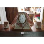 An Art Deco marble clock garniture, 24.5cm high.