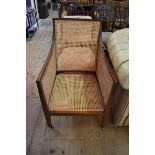 A late 19th/early 20th century mahogany and cane bergere chair.