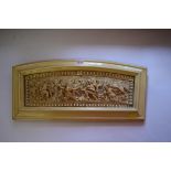 A carved ivory relief plaque, probably 17th/18th century, carved in high relief with a battle of the