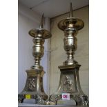 A pair of brass tripod pricket candlesticks, 46cm high.
