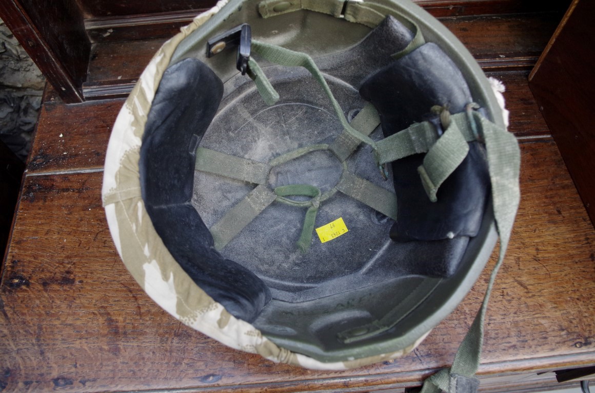 A military helmet, with camouflage cover. - Image 2 of 3