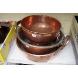 A Victorian twin handled copper preserving pan, 37.5cm wide; together with another similar; and an