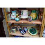 A collection of Majolica items. (2 shelves)