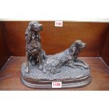 A bronze figure group of two gun dogs, 27cm wide.