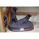 A bronze figure group of two gun dogs, 27cm wide.