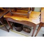 A George III mahogany serpentine tea table, 91cm wide.