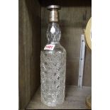 A silver mounted cut glass bottle and stopper, 31cm high, (chips to rim).