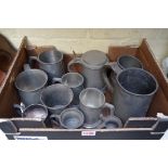 A small collection of pewter tankards, measures and similar.