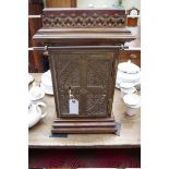 An unusual Victorian oak and gilt metal small safe, in the gothic style, 53cm high, with key.
