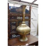 An Islamic brass vase, 53cm high.