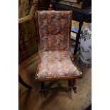 A Victorian mahogany slipper back rocker nursing chair.